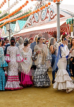 Beautiful Woman wearing flamenco dress at the April Fair Feria de Abril, Seville Fair