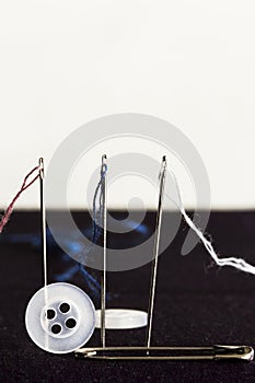 Sew needles, strings, safety pin and buttons - rep