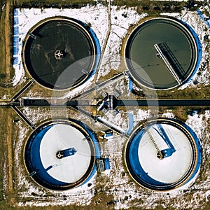 Sewage farm. Static aerial photo looking down onto the clarifying tanks. Industrial place. Geometric background texture. Photo