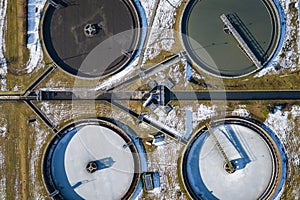 Sewage farm. Static aerial photo looking down onto the clarifying tanks. Industrial place. Geometric background texture. Photo