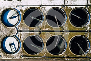 Sewage farm. Static aerial photo looking down onto the clarifying tanks. Industrial place. Geometric background texture. Photo