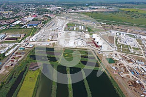 The sewage treatment plant in Slavyansk-on Kuban. Water for sewage treatment in a small city. Bright  on the banks of water