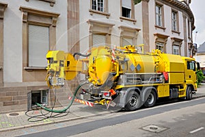 Sewage truck working in urban city environment