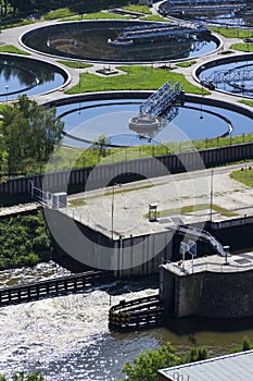 Sewage water treatment plant with river in background