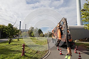 Sewer cleaning with orange truck