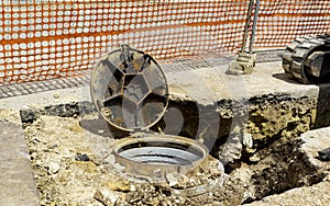 Sewer cover runneth over spilling water into