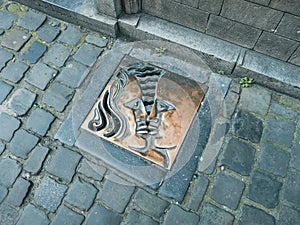 A sewer grate like an art