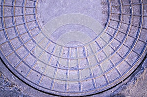 Sewer iron hatch on the sidewalk. background, texture.