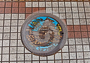 Sewer manhole with Nakatsu castle picture