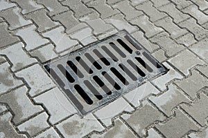 Sewer manhole in the pavement