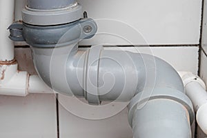 Sewer pipes in home, connection of grey polipropilen pipes for wash basin, washbowl drain