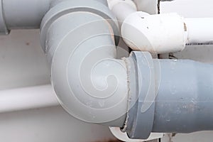 Sewer pipes in home, connection of grey polipropilen pipes for wash basin, washbowl drain