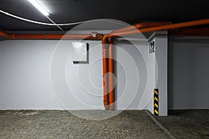 Sewer pipes in the parking lot of a high-rise building. Underground parking for residents of a modern house