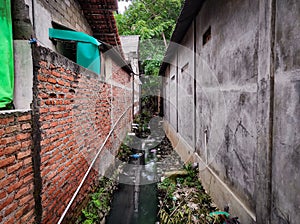 sewerage of dirty water in densely populated areas of Jakarta photo