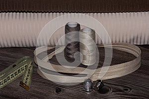 sewing accessories, fabrics on a wooden table