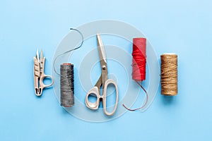 Sewing background with tailor and knitting accessories. Tailoring scissors