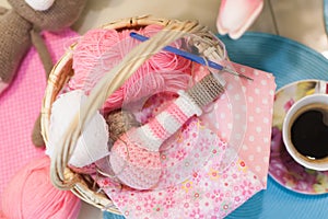 Sewing basket knitting and a Cup of coffee on the table