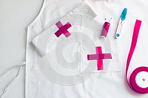 Doctor medical kit and lab coat for kids on a white background photo