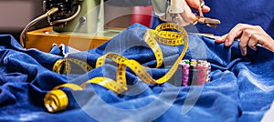 Sewing denim jeans with sewing machine. Repair jeans by sewing machine. Alteration jeans, hemming a pair of jeans, handmade