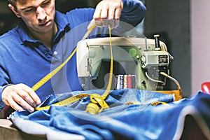 Sewing denim jeans with sewing machine. Repair jeans by sewing machine. Alteration jeans, hemming a pair of jeans, handmade