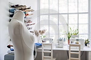 Sewing dressmaker Studio Small Business. Fashion designer working studio, with mannequin, thread spools and sewing