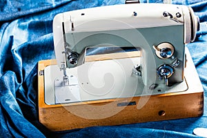 Sewing indigo denim jeans with sewing machine, garment industrial concept.