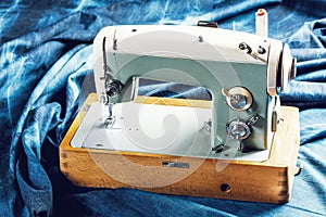 Sewing indigo denim jeans with sewing machine, garment industrial concept.