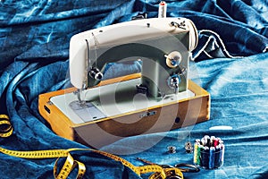 Sewing indigo denim jeans with sewing machine, garment industrial concept.