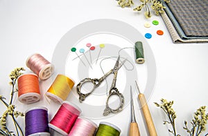 Sewing items on white background