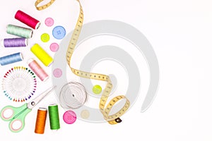 Sewing items on white background