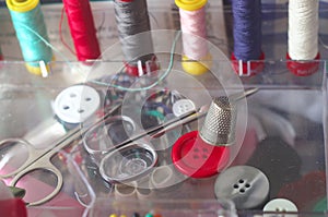 Sewing kit, spools of thread scissors, thimble tailor buttons needles and pins