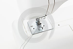 Sewing machine in action with a needle and thread for creative projects