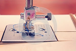 Sewing machine, closeup needle and presser foot with holder