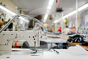 Sewing machine on clothing fabric, nobody