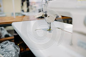 Sewing machine on clothing factory, nobody