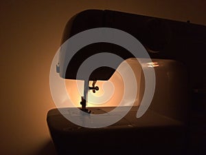 A sewing machine in the darkness