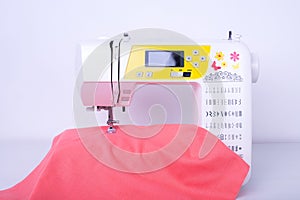 Sewing Machine With Fabric In Needlework Workshop