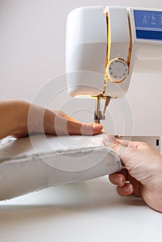 Sewing machine with girl close-up