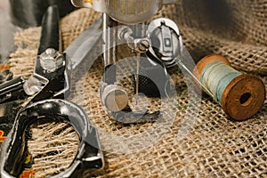 Sewing machine. Needle and thread. Scissors. Sewing tools for fashion designers, designers, and seamstresses. Tailoring