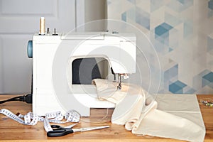 Sewing machine with piece of fabric on table