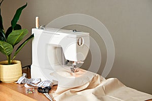 Sewing machine with piece of fabric on table