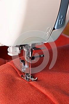 Sewing machine and red fabric