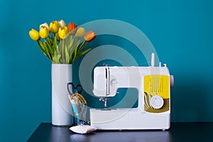 Sewing machine on table in workshop.