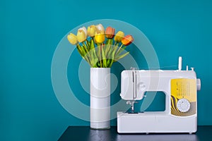 Sewing machine on table in workshop.