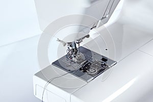 Sewing machine with thread, closeup