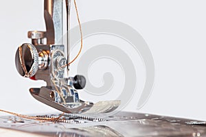 Sewing machine with thread in needle background