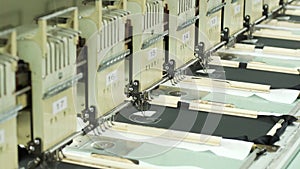 Sewing machines. Seamstress sews clothes. Sewing factory. Sewing company. Seamstress.