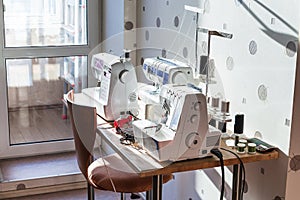 Sewing machines and serger on table