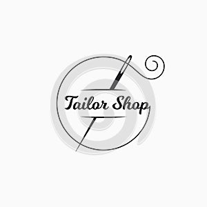 Sewing needle logo. Tailor shop with thread photo