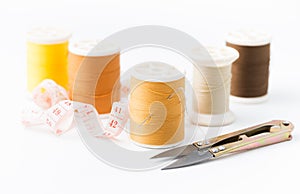 Sewing needle in orange thread